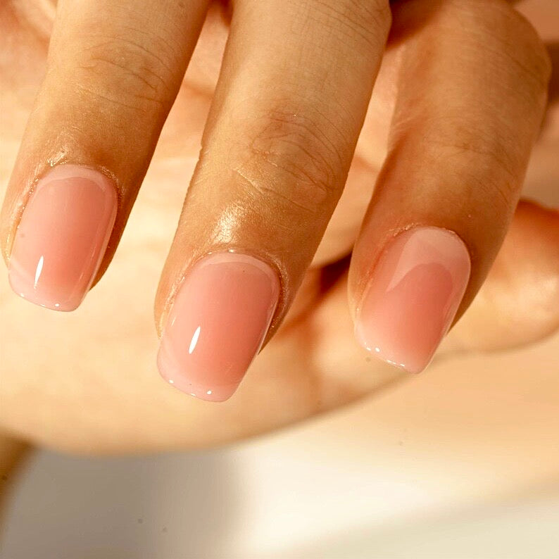 Hand showing Decode beauty warm nude builder gel press on nails
