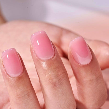 Hand showing light pink gel nails the best pink nail shade